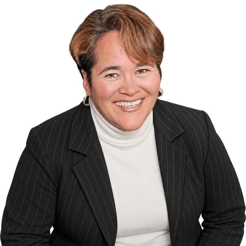 Vickie Helm smiling in a black pinstripe jacket